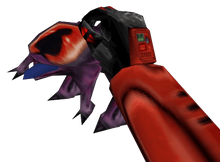 Gordon Freeman's hand holds a dangling Chumtoad, a purple frog-like creature with one big red eye.